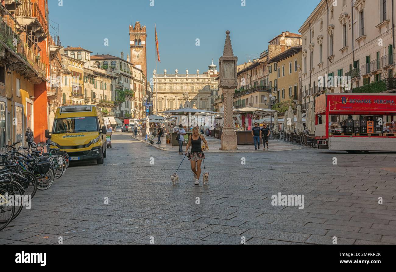 Piazza delle Erbe street in the historic centre of Verona town, Veneto region in northern Italy - Europe, September 9, 2021 Stock Photo