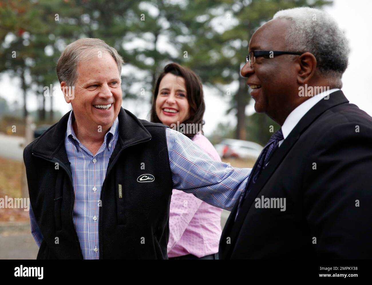 Democratic senatorial candidate Doug Jones, left, laughs with his wife ...