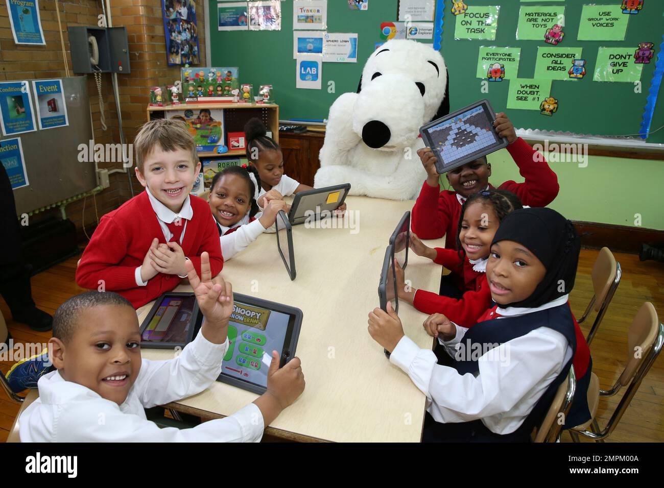 IMAGE DISTRIBUTED FOR CODESPARK ACADEMY - Snoopy teams with codeSpark  Academy and debuts Snoopy Snow Brawl, a learn to code game with students at  PS 241 during Code.orgs Hour of Code on