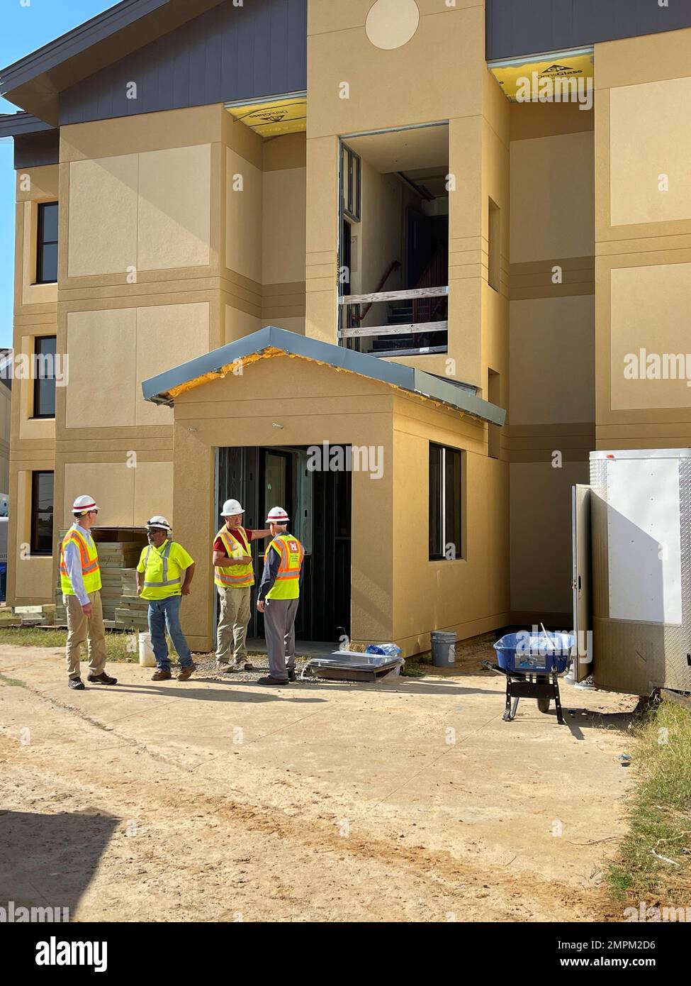 Corps personnel inspect ongoing construction at one of the VOLAR barracks in Fort Polk, LA during a recent site visit.  The Barracks renovations will raise ceilings, improve lighting, and convert existing two-bedroom areas into larger one-bedroom suites. Stock Photo