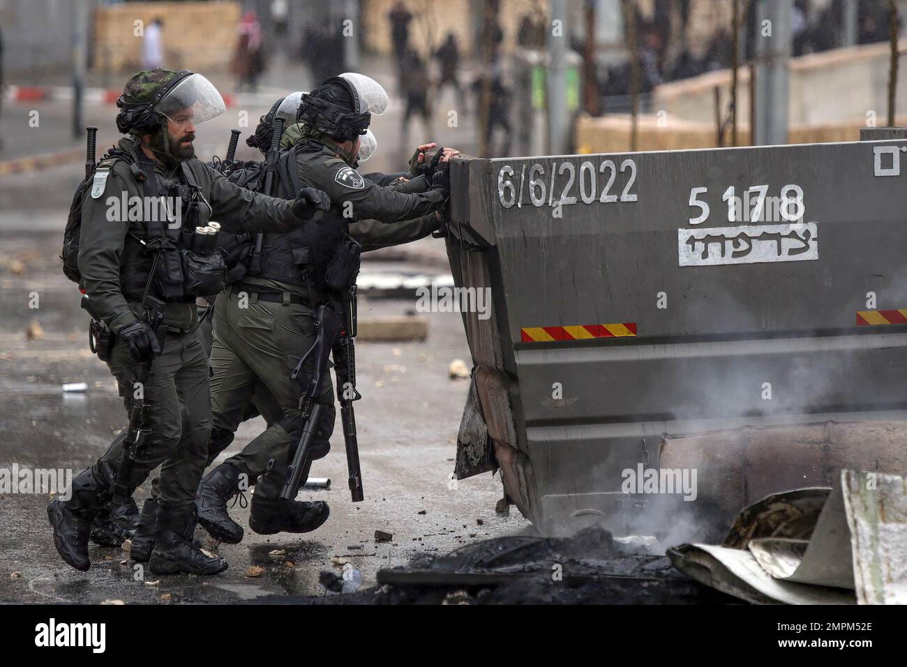 Jerusalem, Israel. 31st Jan, 2023. Israeli police remove obstacles from the middle of the road after being blocked by protesters during the demonstration. The general strike was against house demolitions. Credit: SOPA Images Limited/Alamy Live News Stock Photo