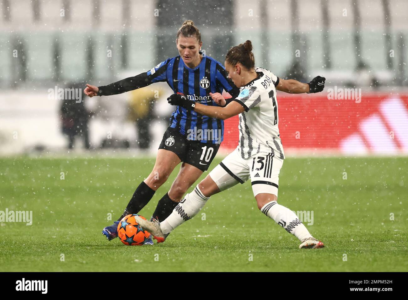 Turin, Italy, 15th December 2022. Lisa Boattin of Juventus challenges Viktoria Pinther of FC Zurich during the UEFA Womens Champions League match at Juventus Stadium, Turin. Picture credit should read: Jonathan Moscrop / Sportimage Stock Photo