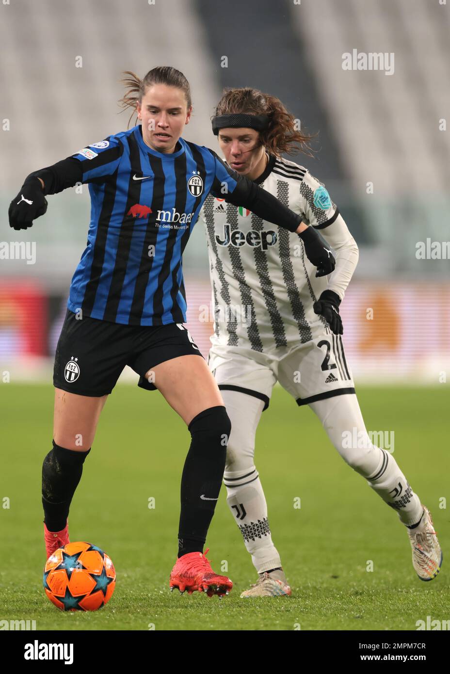 Turin, Italy, 15th December 2022. Naomi Megroz of FC Zurich holds off Sofie Junge Pedersen of Juventus during the UEFA Womens Champions League match at Juventus Stadium, Turin. Picture credit should read: Jonathan Moscrop / Sportimage Stock Photo