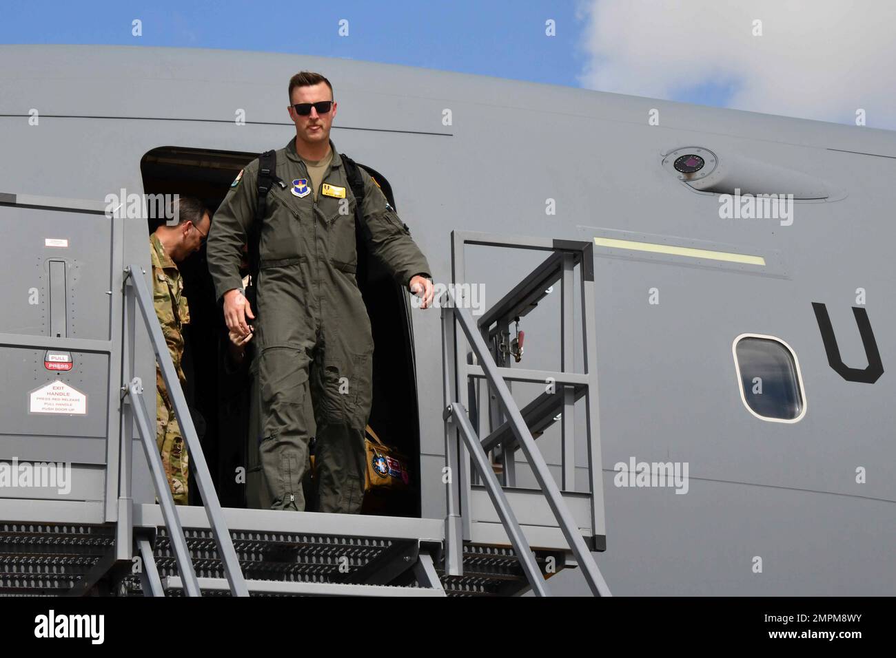 1st Lt. Wyatt Starr, 56th Air Refueling Squadron (ARS) copilot in training, walks off a KC-46 Pegasus after his final student flight at Altus Air Force Base, Oklahoma, Nov. 3, 2022. Students from the 56th ARS have originally transitioned from other air refueling tankers, but now the squadron has developed a syllabus to train students with no tanker experience. Stock Photo