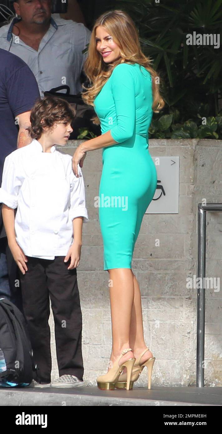 Sofia Vergara shows off her incredible figure in a tight green dress and sky high heels during another scene at a hotel in South Beach. Meanwhile, John Leguizamo was spotted holding hands Sofia Vergara shows off her incredible figure in a tight green dress and sky high heels during another scene at a hotel in South Beach. Meanwhile, John Leguizamo was spotted holding hands