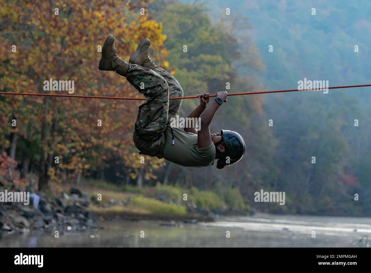 An Army JROTC Cadet from Zachary High School works to pull herself