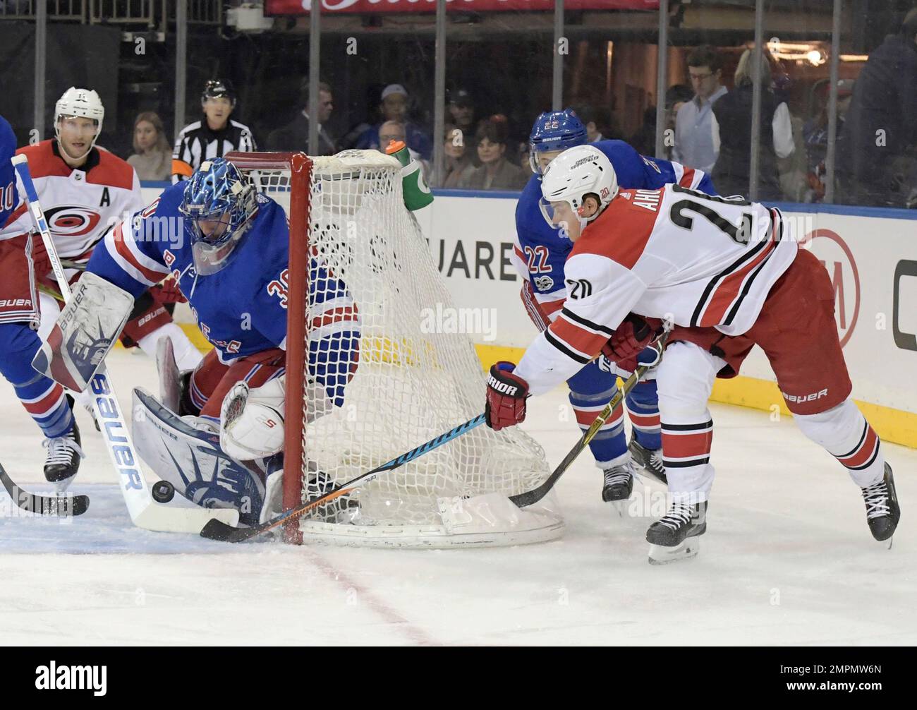 New York Rangers goalie Henrik Lundqvist (30) deflects the puck on a ...