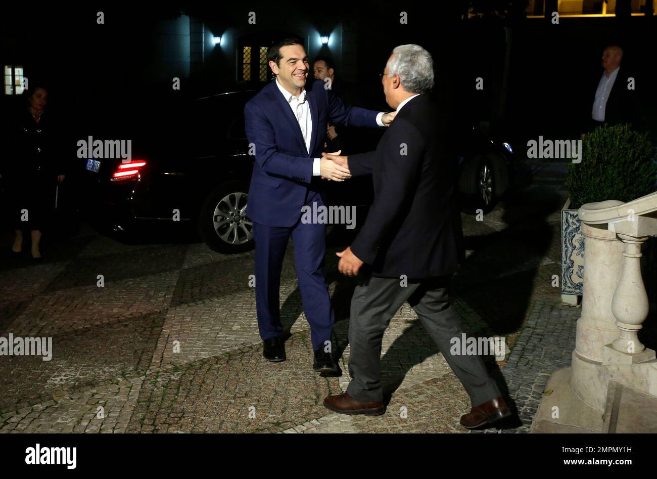 Greece Prime Minister Alexis Tsipras, Left, Is Welcomed By His ...