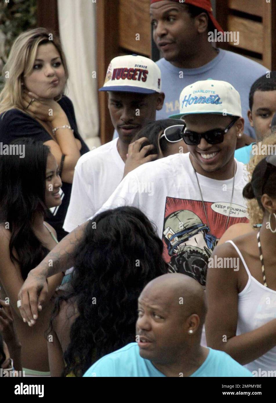 Exclusive!! Singer Chris Brown, sporting a wifebeater tank top, seems ...
