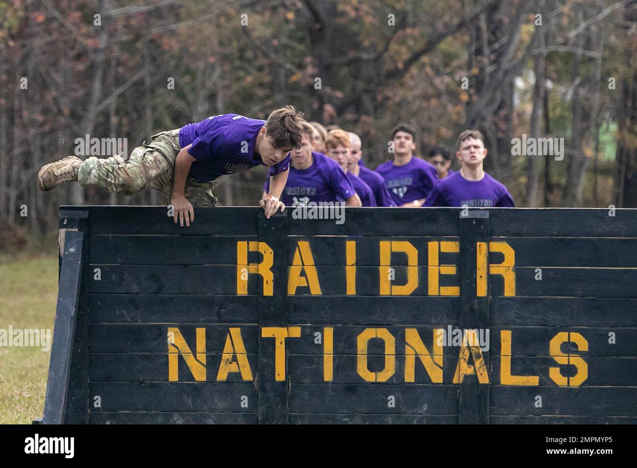 Army JROTC Cadets from Riverside High School hurdle a barrier in the