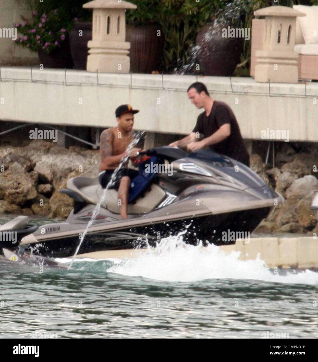 Chris Brown was all smiles and enjoying himself on a jetski after being  reunited with girlfriend Rihanna at P Diddy's $50 million dollar Star  Island mansion the previous night. The reconciliation comes, image size:1222x1390