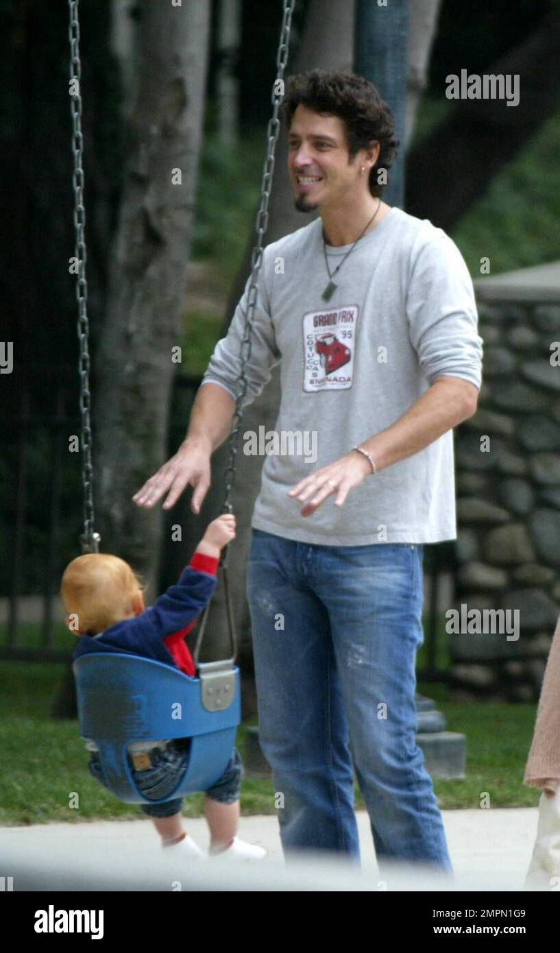 Child pushed on swing hires stock photography and images Alamy