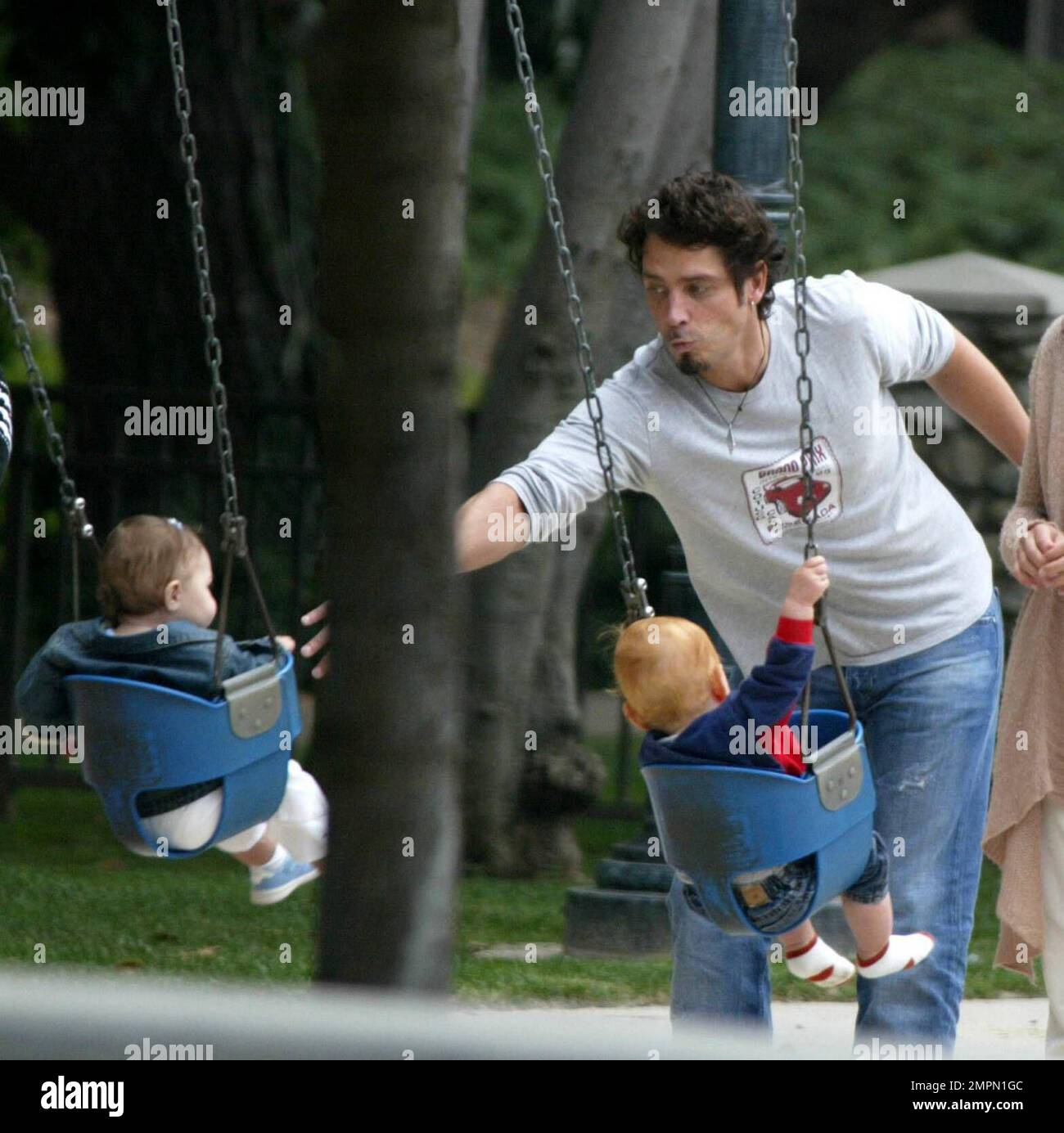 Child pushed on swing hires stock photography and images Alamy