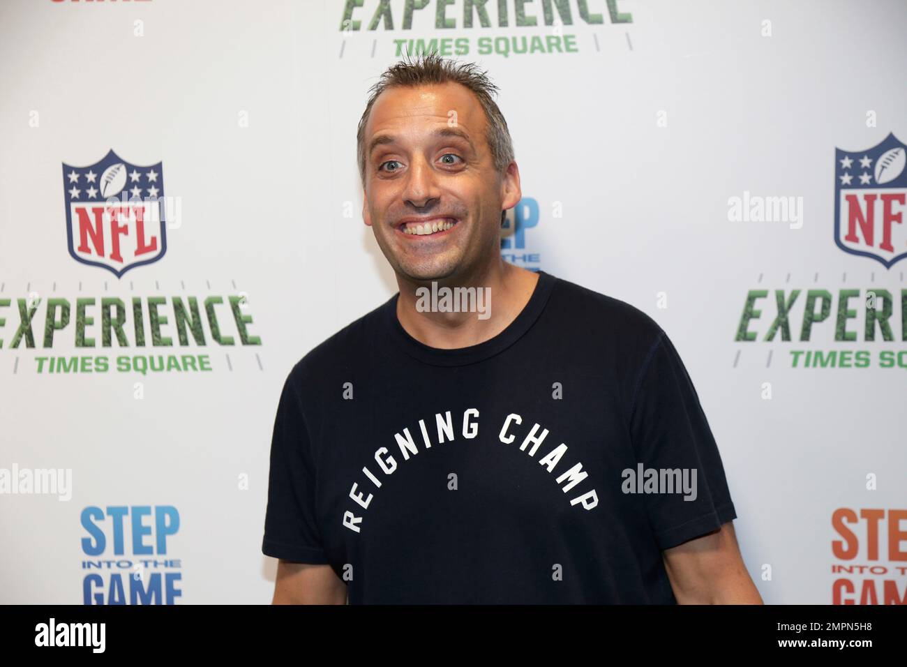 Joe Gatto of "Impractical Jokers" poses for a picture at the opening of "NFL Experience" in Times Square, New York, Thursday, Nov. 30, 2017. (AP Photo/Seth Wenig) Stock Photo