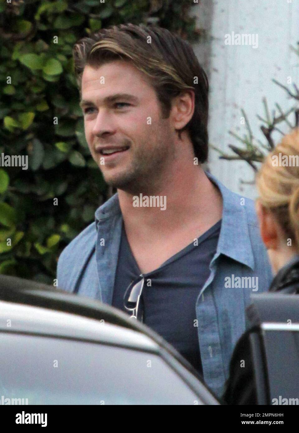 EXCLUSIVE!! Actor Chris Hemsworth carries a variety of shirts as he leaves an all day photo shoot, presumably in connection with his upcoming film 'Thor'.  Despite looking a bit tired as he wiped his eyes Chris also looked in good spirits as he appeared to pose for a picture with crew while 'Thor' director Kenneth Branagh got in to a waiting limo.  At one point police were seen responding to theatrical smoke effects that billowed from the photography studio.  'Thor' is due out this spring and co-stars Natalie Portman and Anthony Hopkins. Los Angeles, CA. 01/29/11. Stock Photo