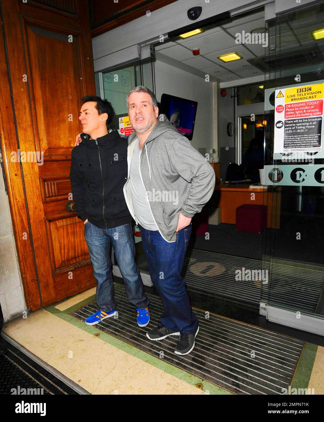 On Red Nose Friday BBC Radio DJs Chris Moyles and Comedy Dave (aka David  Vitty) are all smiles as they leave BBC Radio studios following their  wildly extended 52-hour show which they