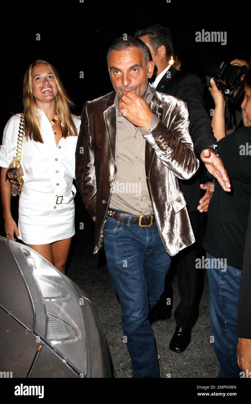 Fashion Designer Christian Audigier and his wife Ira attend a red