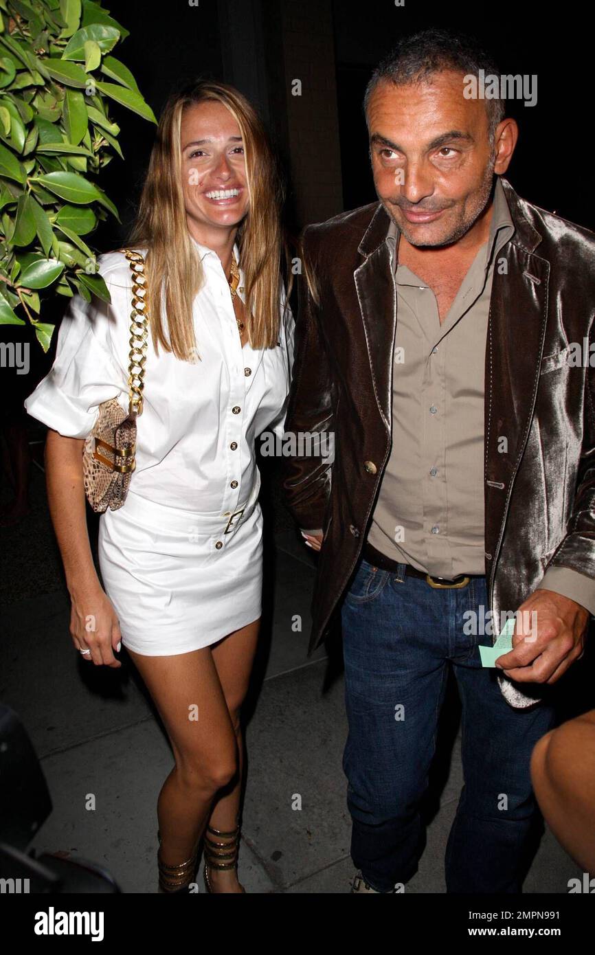Fashion Designer Christian Audigier and his wife Ira attend a red