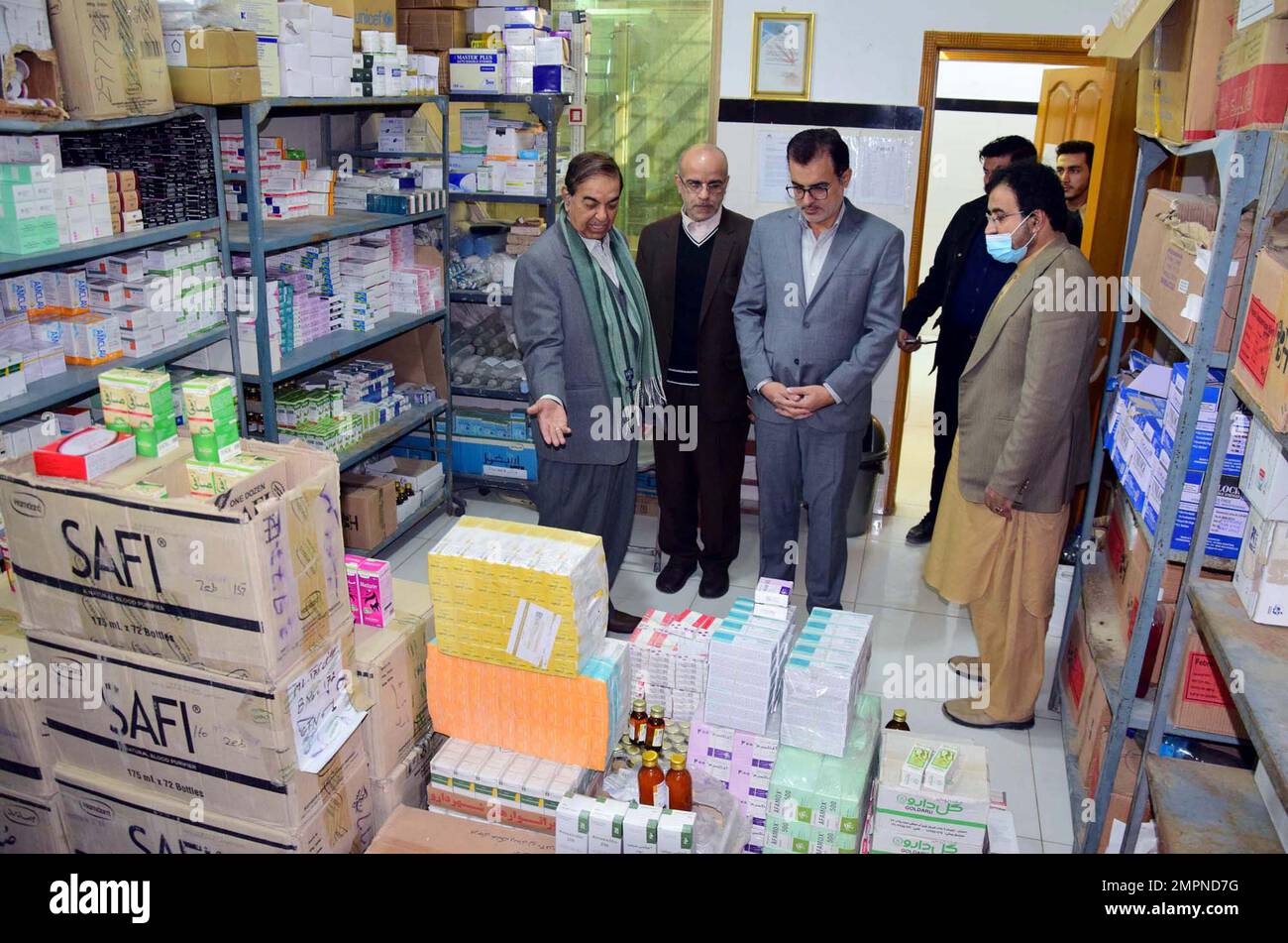 Vice Consul General Peer Loreen and Consulate Officer Bahram Khadmin, Chief Executive of Jam Shifa Hospital, Dr. Muhammad Ishaq Jamiat inspecting the medicines given to Jam Shifa Hospital donated by Red Crescent of the Islamic Republic of Iran and visiting the hospital in Quetta on Tuesday, January 31, 2023. Stock Photo