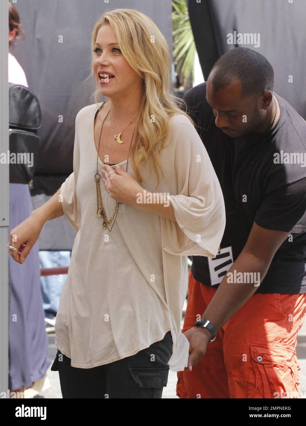 Wearing a loose tan top with black skinny jeans and sandals, Christina  Applegate was spotted at the Grove shopping center where she made an  appearance on 'Extra' tv program with host Mario