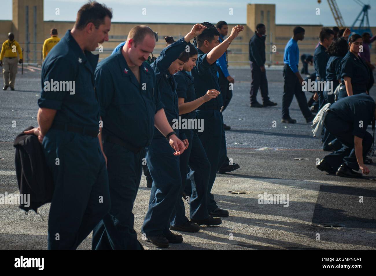 221107-N-MD713-1032 PORTSMOUTH, Va. (Nov. 7, 2022) Sailors conduct a foreign object debris walk-down on the flight deck aboard the Nimitz-class aircraft carrier USS Dwight D. Eisenhower (CVN 69). IKE is conducting a fast cruise, which is a simulated underway period consisting of drills and training evolutions that test the equipment and systems on the ship to prepare the crew to operate at sea. Stock Photo