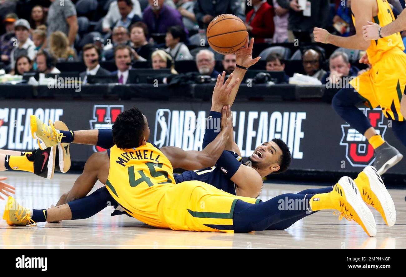 Utah Jazz guard Donovan Mitchell (45) and Denver Nuggets guard Jamal