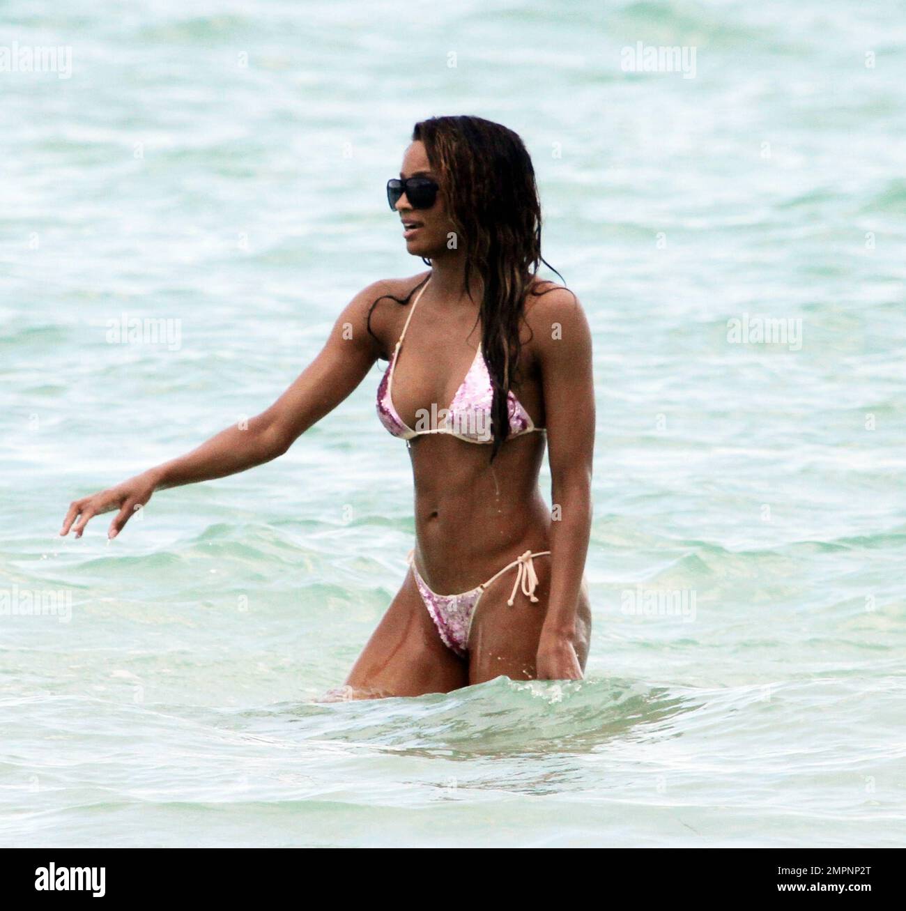 Beautiful singer Ciara nearly had a wardrobe malfunction today. While  playing in the strong waves her bikini top started to slip. Ciara frolicked  in the water with a friend as a storm