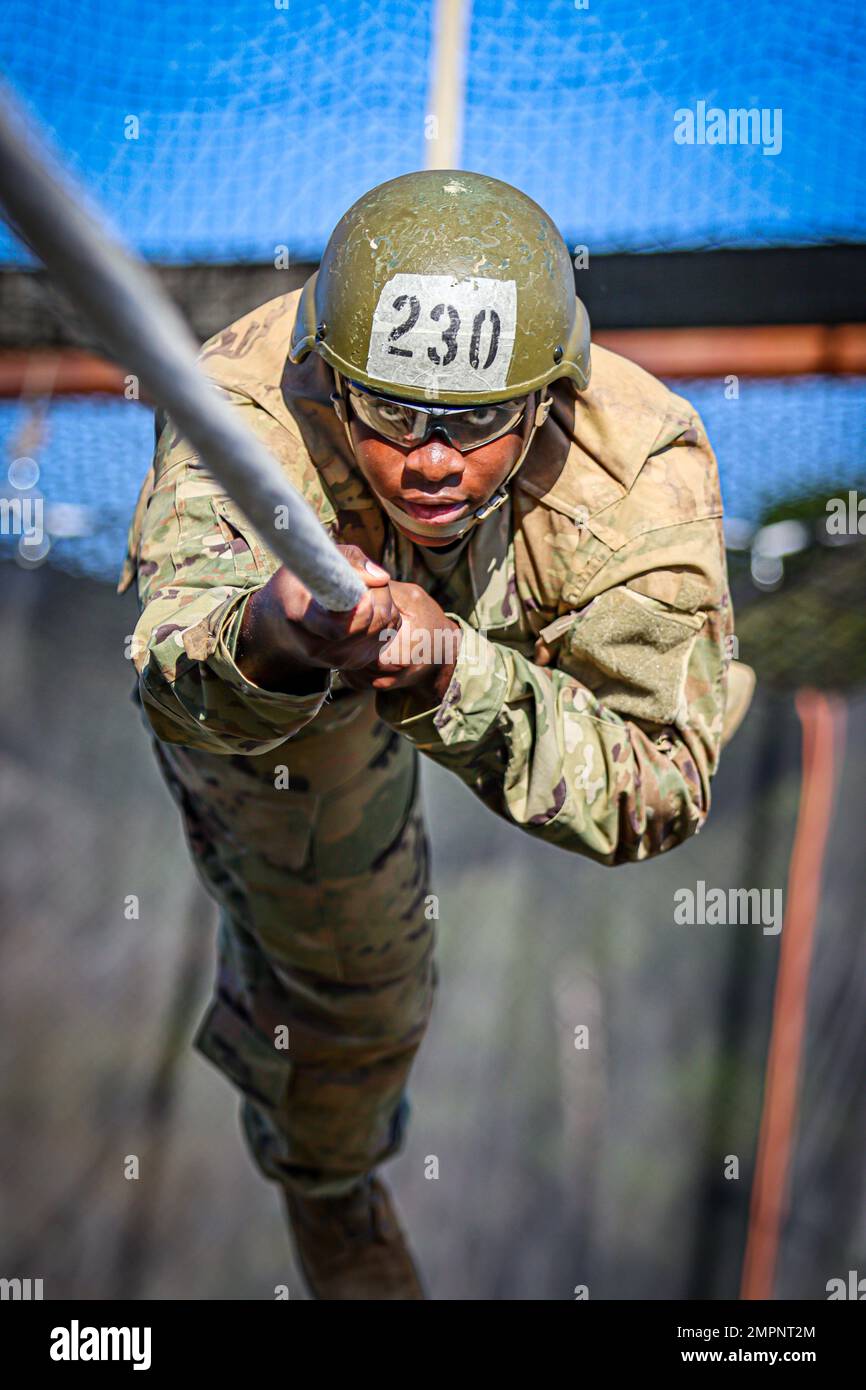 A U.S. Army Infantry soldier-in-training assigned to Alpha Company, 2nd Battalion, 58th Infantry Regiment, 198th Infantry Brigade, traverses Eagle Tower on November 8, 2022, on Fort Benning, GA. Stock Photo