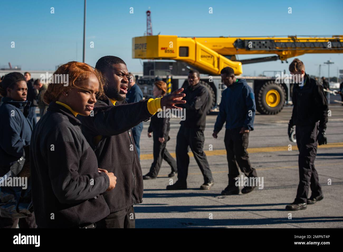 221108-N-MD713-1040 PORTSMOUTH, Va. (Nov. 8, 2022) Sailors conduct a foreign object debris walk-down on the flight deck aboard the Nimitz-class aircraft carrier USS Dwight D. Eisenhower (CVN 69). IKE is conducting a fast cruise, which is a simulated underway period consisting of drills and training evolutions that test the equipment and systems on the ship to prepare the crew to operate at sea. Stock Photo