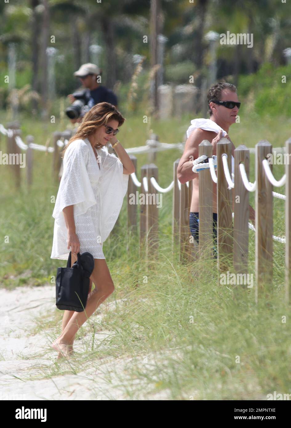 Cindy Crawford gets dressed after an early morning swim in the ocean