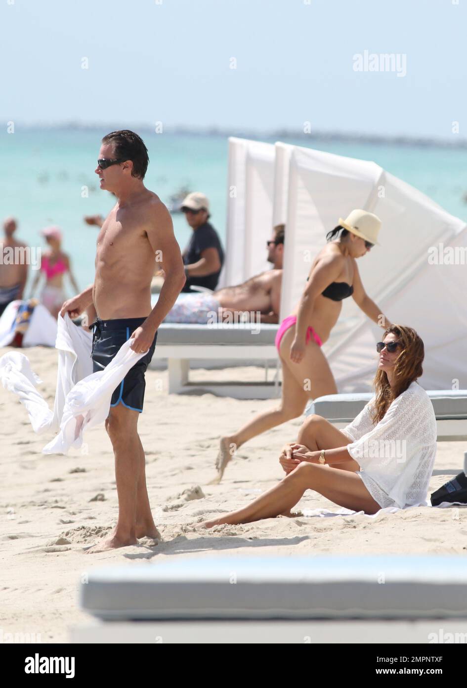 Cindy Crawford gets dressed after an early morning swim in the ocean