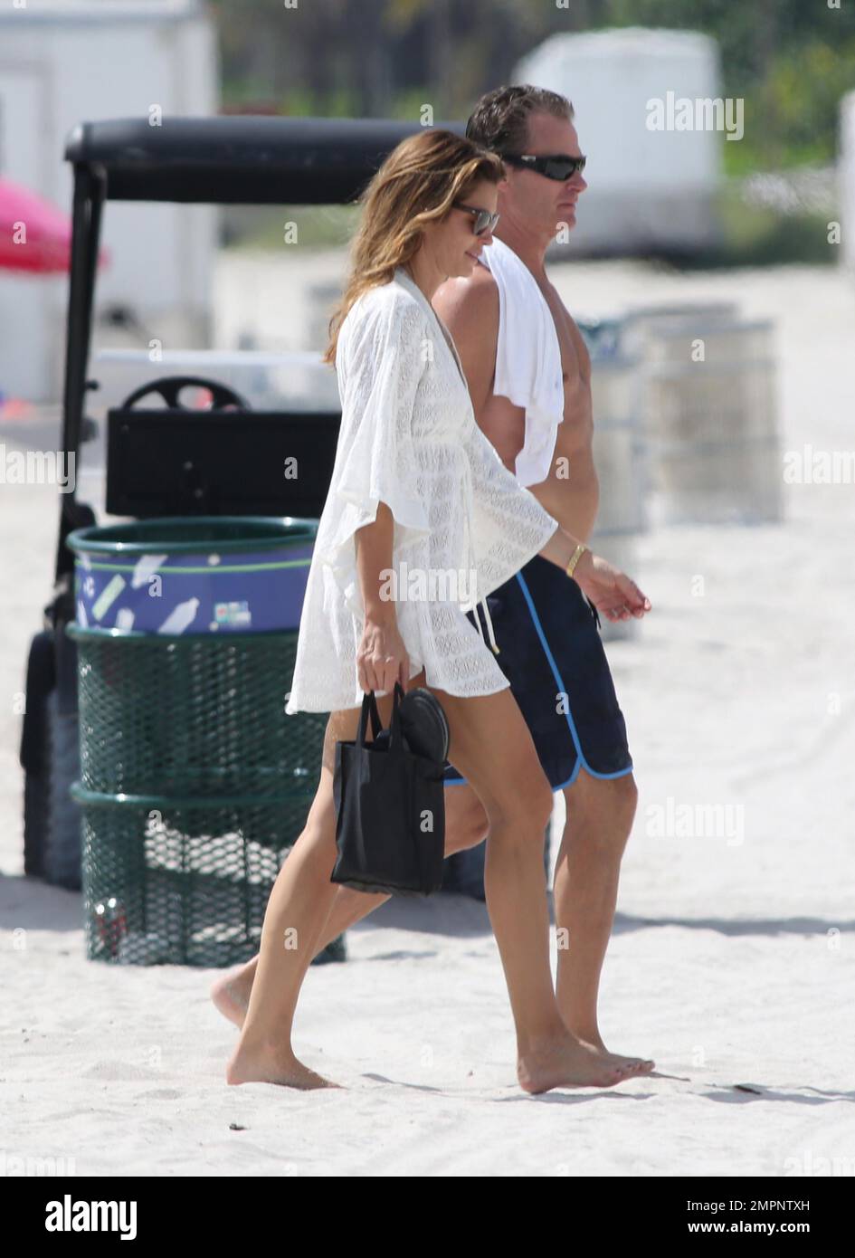 Cindy Crawford gets dressed after an early morning swim in the ocean