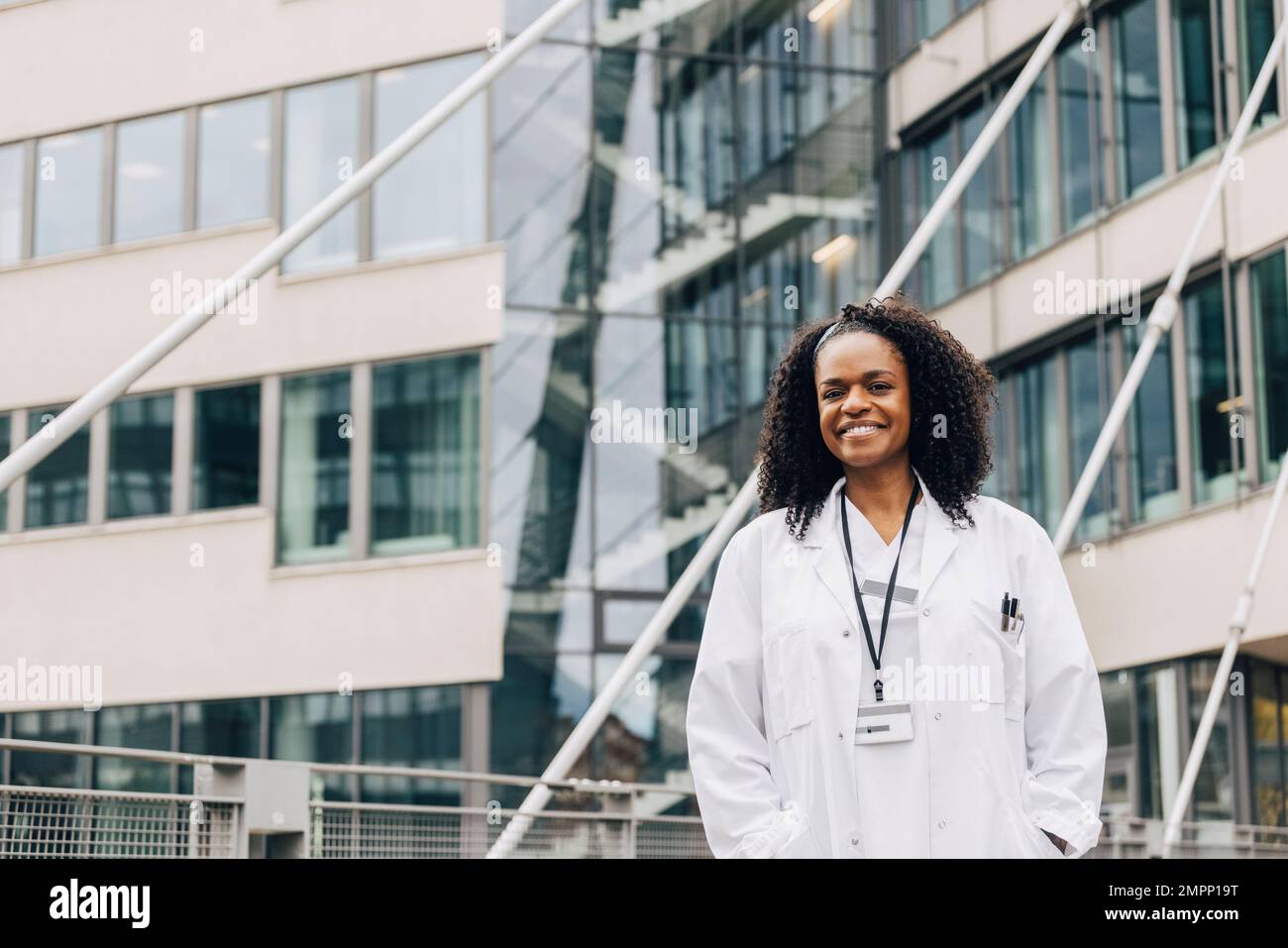 Portrait happy female doctor hi-res stock photography and images - Alamy