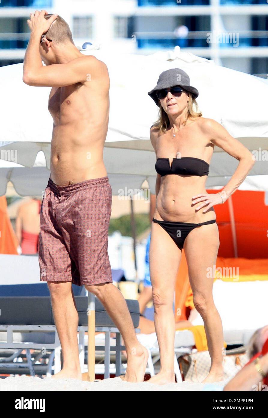 French journalist, romance writer and director of news at TF1, Claire Chazal  wears a black bikini as she relaxes on the beach during a winter holiday  with husband Arnaud Lemaire. Chazal, who