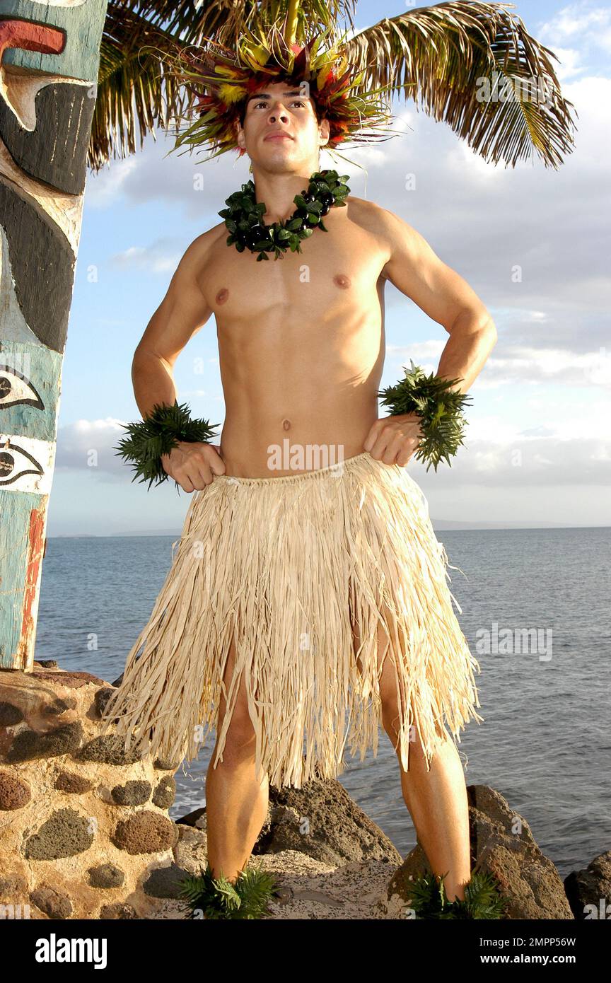 Male Hula dancer standing tall in front of a beautiful ocean view. Stock Photo