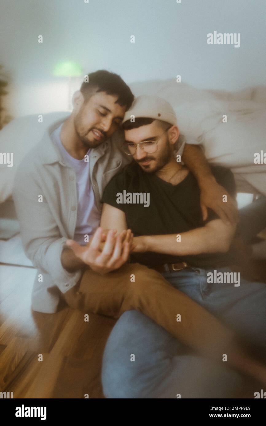 Gay couple holding hands view hi-res stock photography and images - Alamy