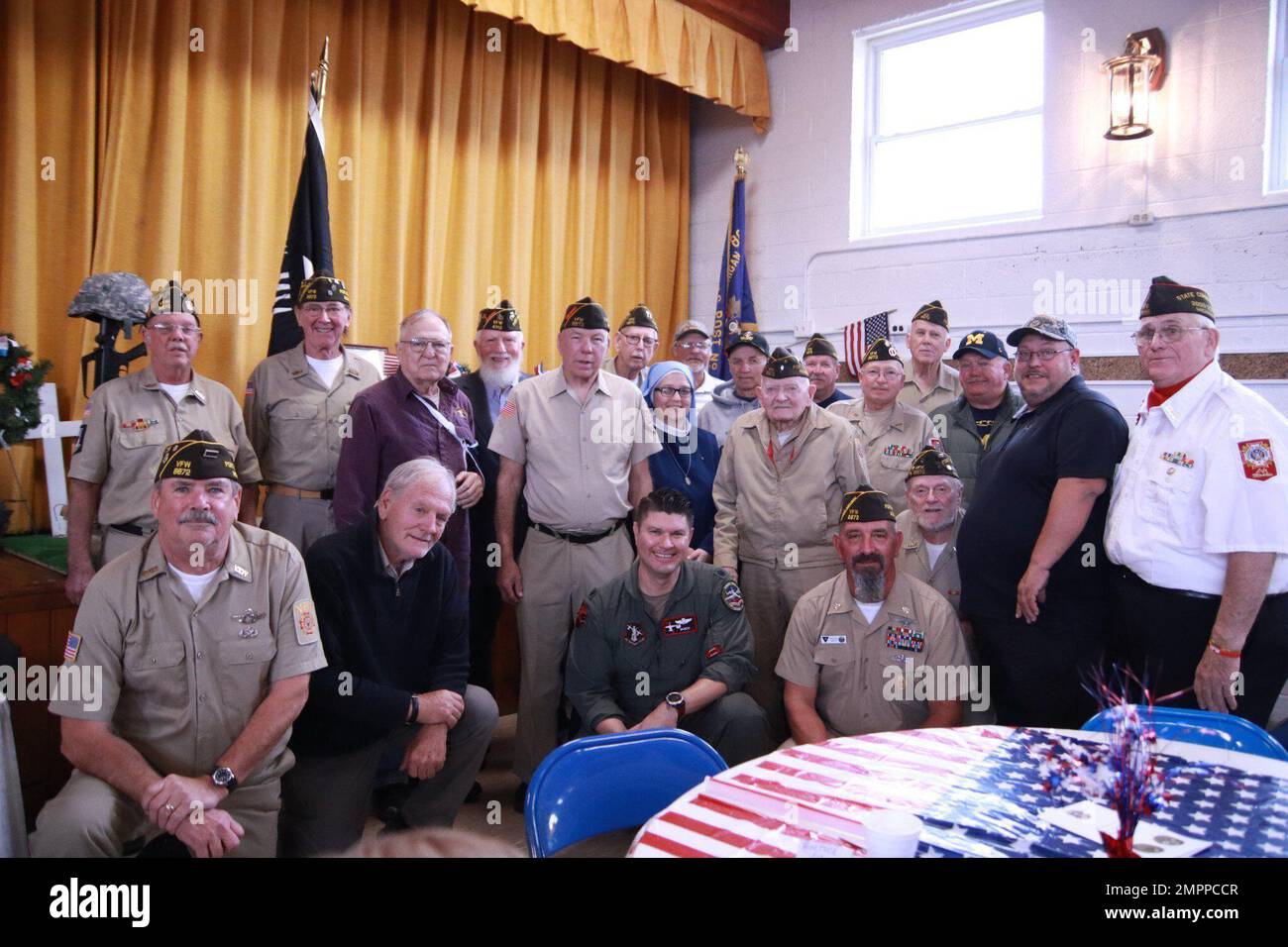 Air National Guard pilot Lt. Col. William 'DISCO' Rundell, commander of the 107th Fighter Squadron at Selfridge Air National Guard Base, Michigan, (kneeling venter) celebrated Veterans Day Nov. 11, 2022 at the Port Sanilac VFW Post 8872. Stock Photo