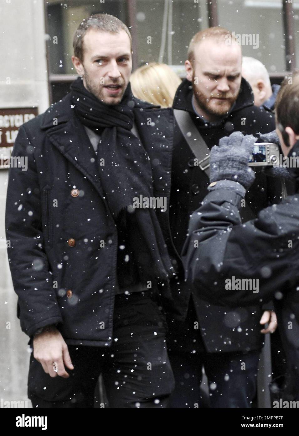 UK band Coldplay look in lively spirits as they stand outside BBC Radio  studios during a snowy afternoon. The group, Chris Martin, Jonny Buckland,  Guy Berryman and Will Champion, appeared on BBC