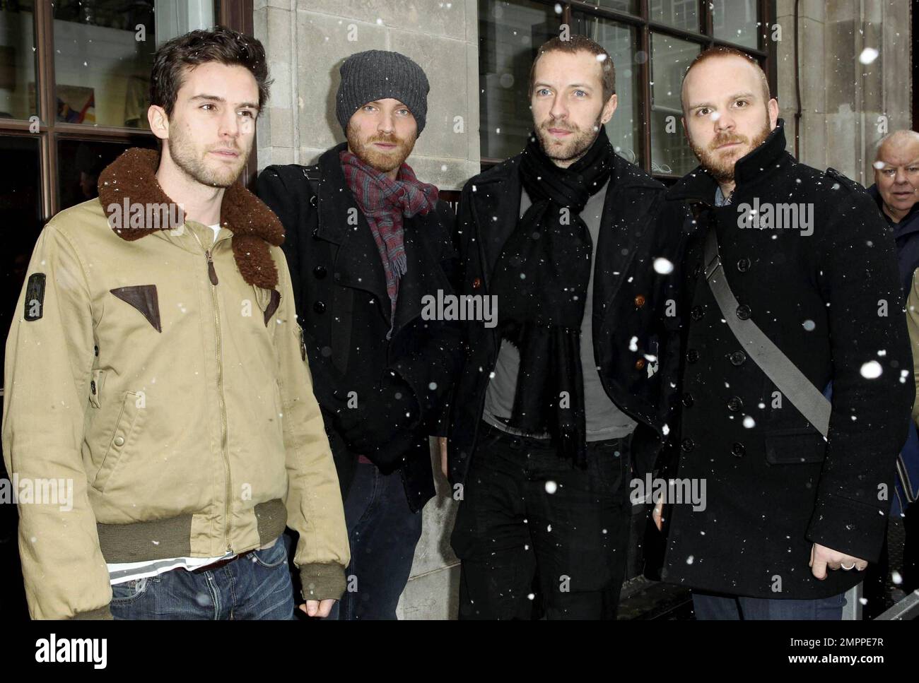 UK band Coldplay look in lively spirits as they stand outside BBC