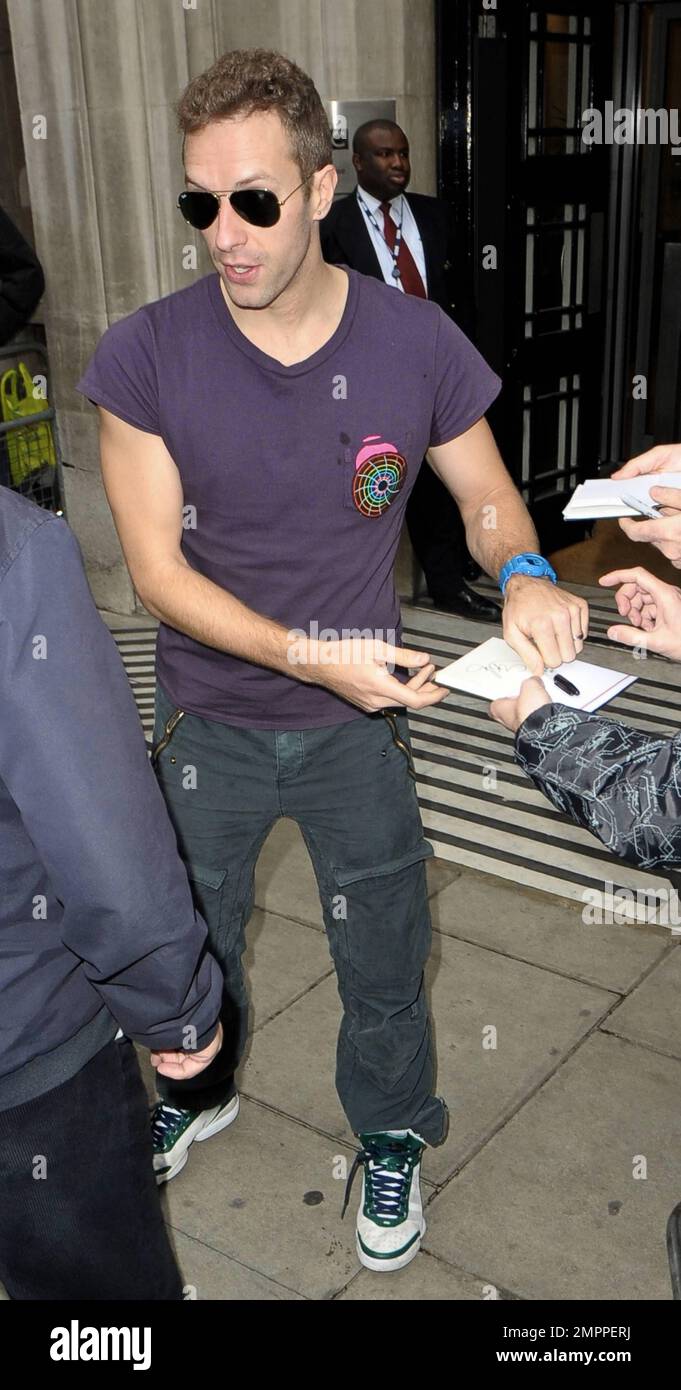 Coldplay's" frontman Chris Martin was seen outside of BBC Radio 2 in a  purple t-shirt, grey trousers, white sneakers and sunglasses. Martin made  some time to sign autographs for waiting fans but