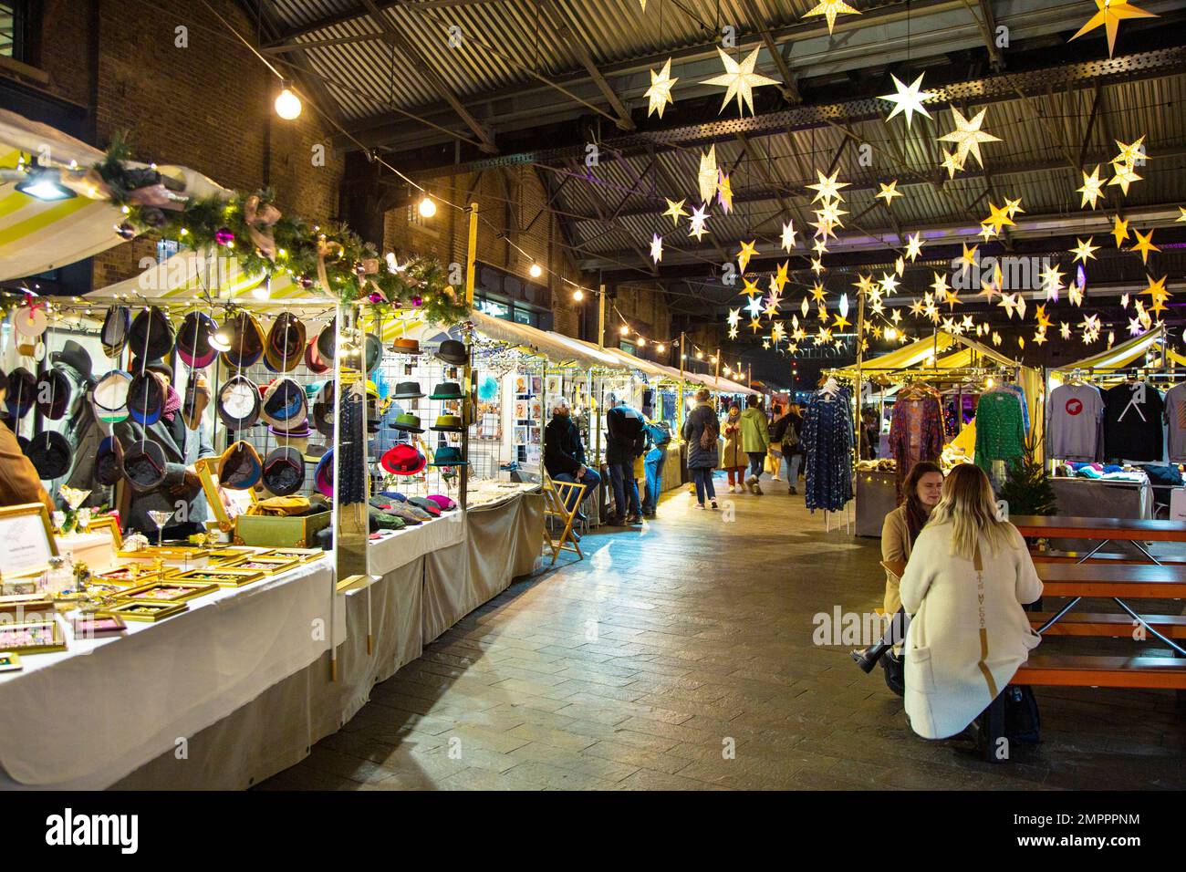 Stalls and festive lights at the Christmas at Canopy Market, King's Cross, North London, UK