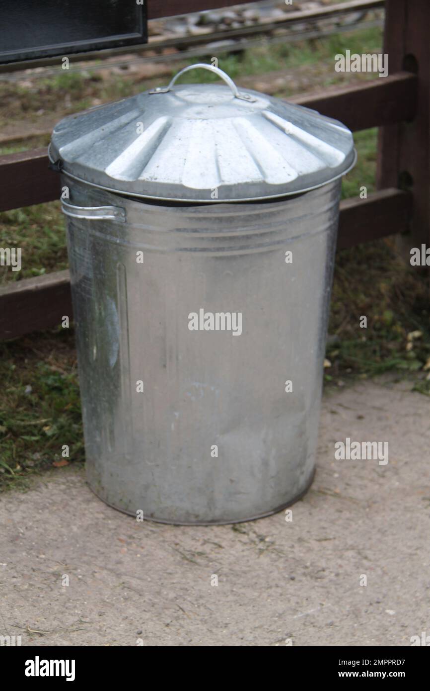 A Traditional Galvanised Metal Dustbin Garbage Can. Stock Photo