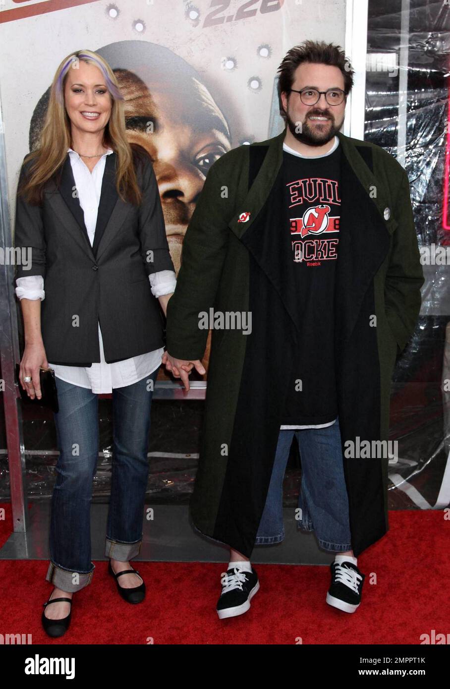 Kevin Smith (R) and wife Jennifer Schwalbach at the world premiere of 'Cop Out' in New York, NY. 2/22/10. Stock Photo