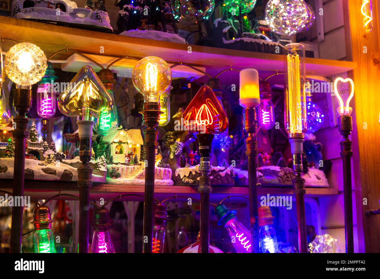 Colourful novelty light bulbs in a shop window display Stock Photo