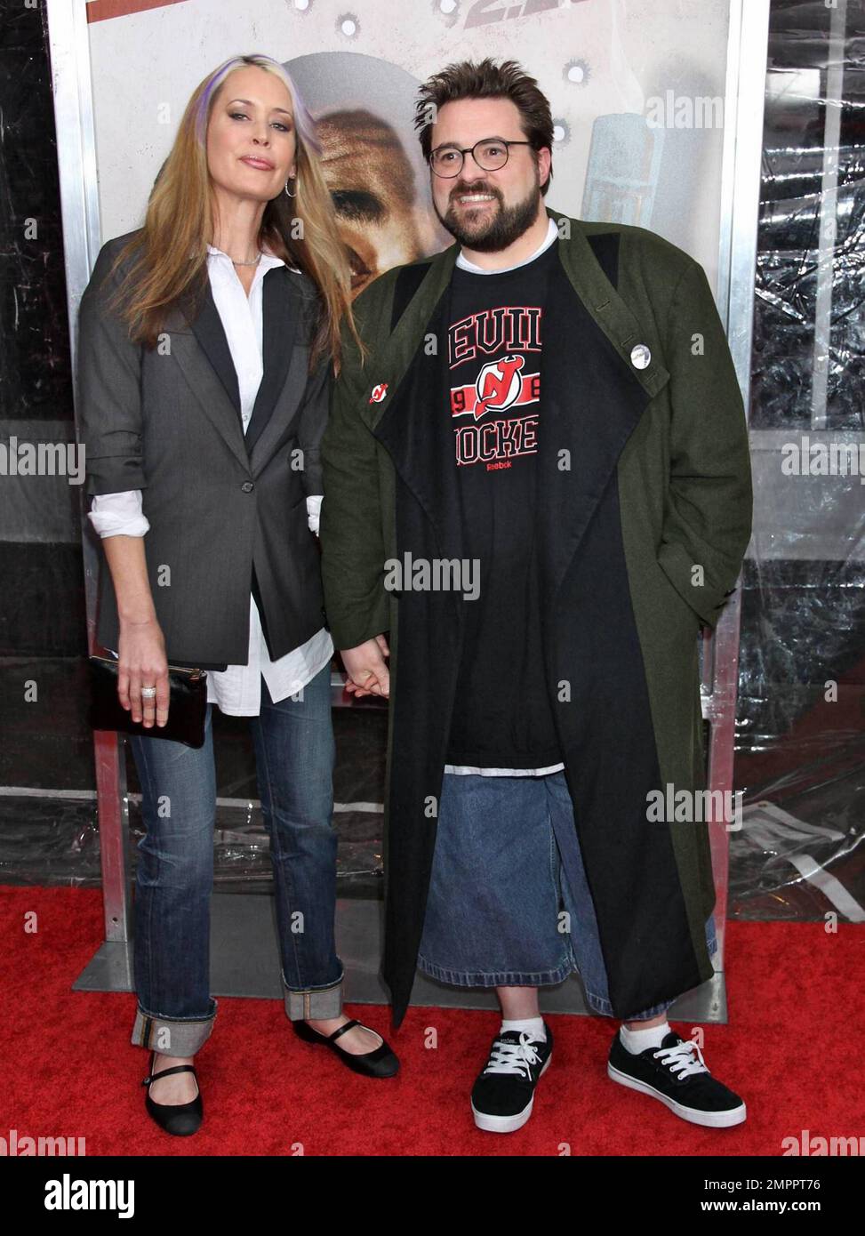Kevin Smith (R) and wife Jennifer Schwalbach at the world premiere of 'Cop Out' in New York, NY. 2/22/10.    . Stock Photo