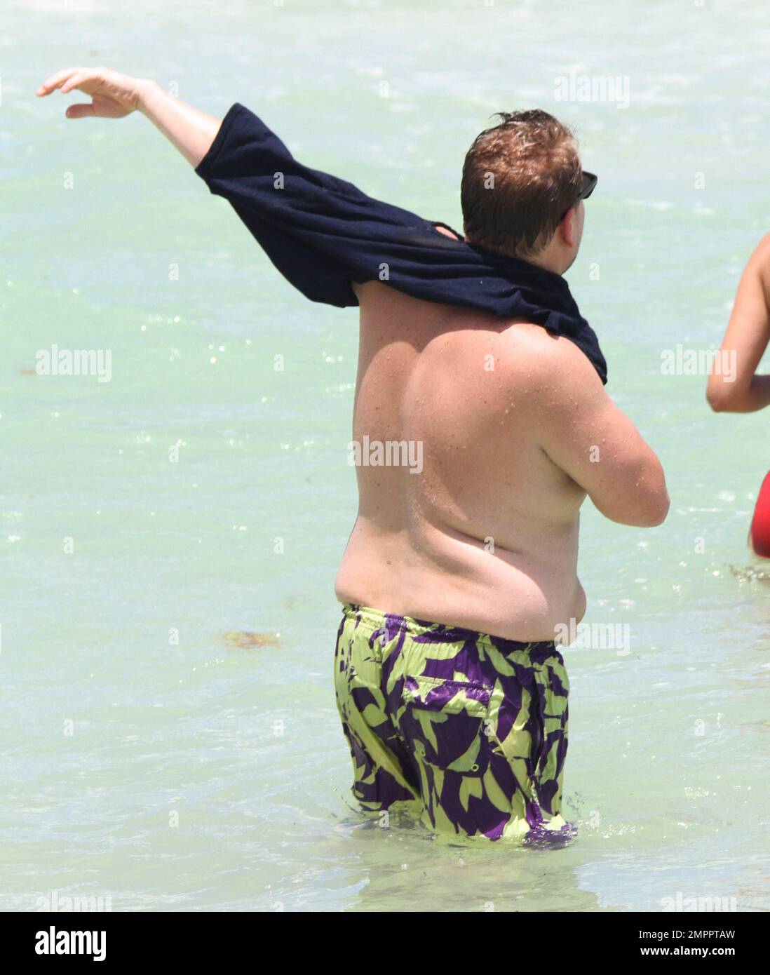 James Corden and his wife spend a fun afternoon at the beach. Corden showed  played in the waves and his wife Julia showed off her flawless beach body  in striped bikini. Miami,