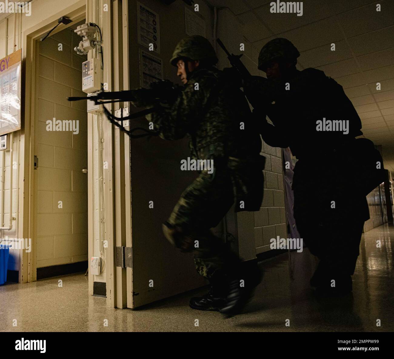 Members with Japan Ground Self-Defense Force, 51st Infantry Regiment, breach a room during a simulated bilateral search while participating in Exercise Keen Sword 2023 on Camp Foster, Okinawa, Japan, Nov. 13, 2022. Keen Sword exercises the combined command and control capabilities and lethality developed between Marine Corps Installations Pacific, III Marine Expeditionary Force, and the Japan Self-Defense Force. This bilateral field-training demonstrates the U.S. military and JSDF interoperability and combat readiness of the U.S.-Japan Alliance. Stock Photo