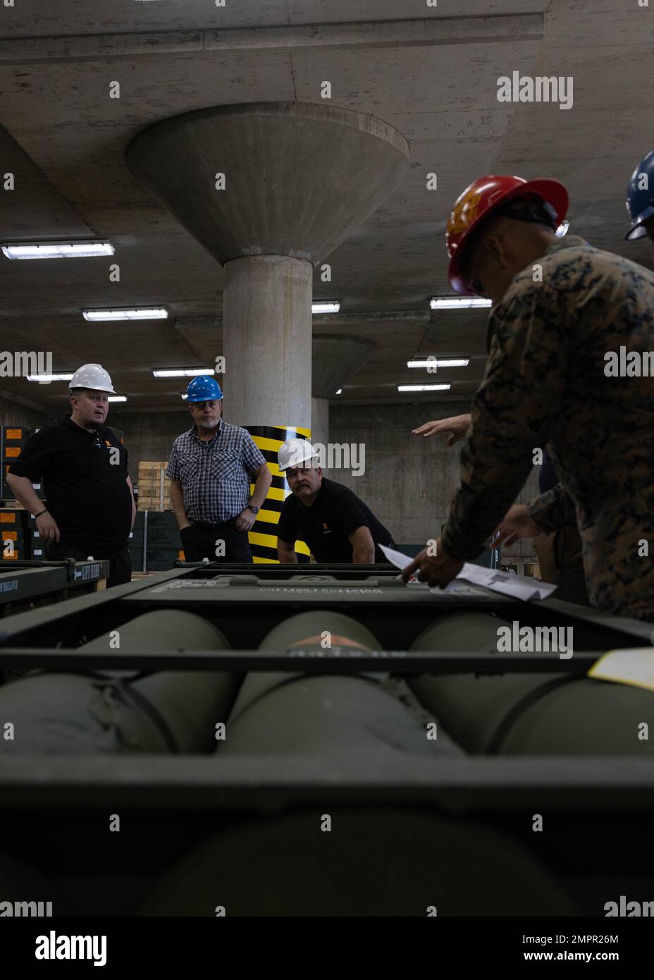 U.S. Marines with Ammunition Company, 1st Supply Battalion, 1st Marine Logistics Group, and Norwegian contractors from Marine Corps Prepositioning Program-Norway, observe the ammunition during MCPP-N training on Camp Pendleton, California, Nov. 15, 2022.  The MCPP-N provides the Marine Corps with the logistical capability to store, segregate, and issue ammunition properly in support of current and future operations. Stock Photo