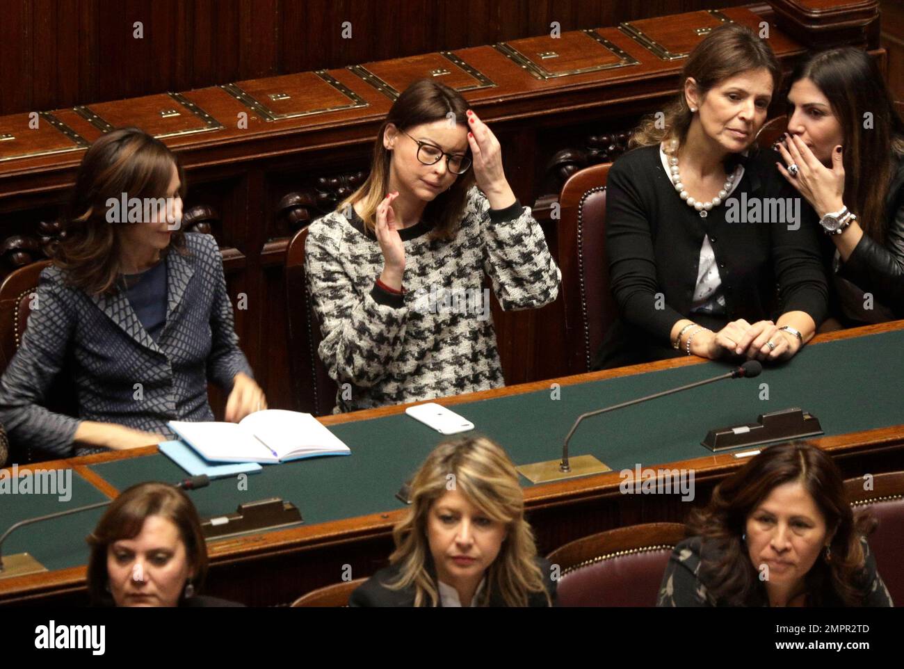 Lawyer Lucia Annibali, center, a victim of an acid attack, sits amongst  other women during a special conference on the occasion of the  International Day for the Elimination of Violence against Women,, image size:1300x962