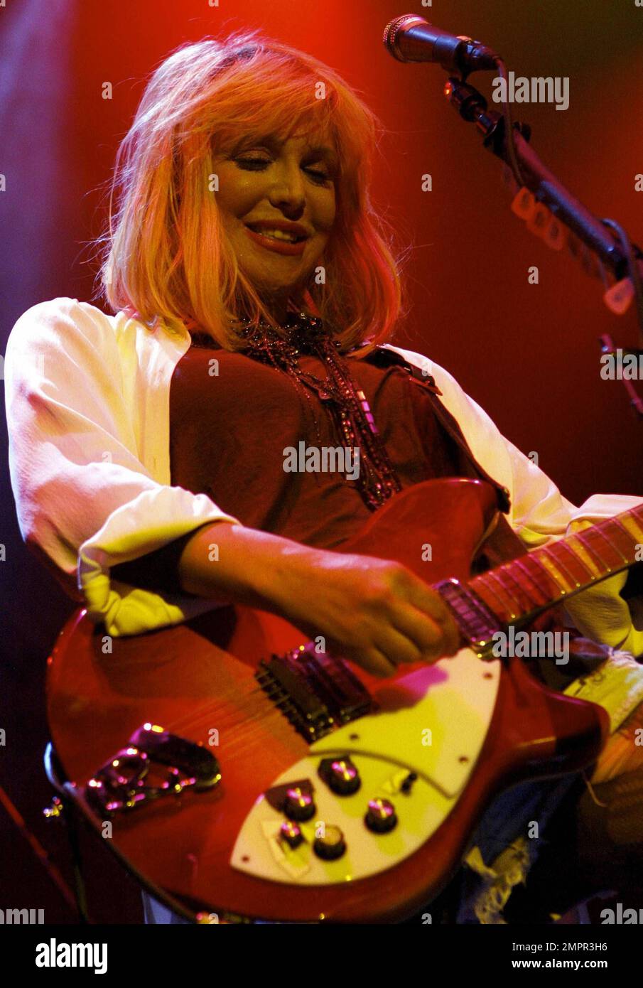 Courtney Love smokes a cigarette on stage as she performs live in ...